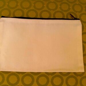 Cream and black canvas cosmetics pouch